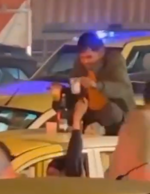 Viral Video: Man Drinks Alcohol On Car’s Roof in a busy Traffic Jam In Gurugram